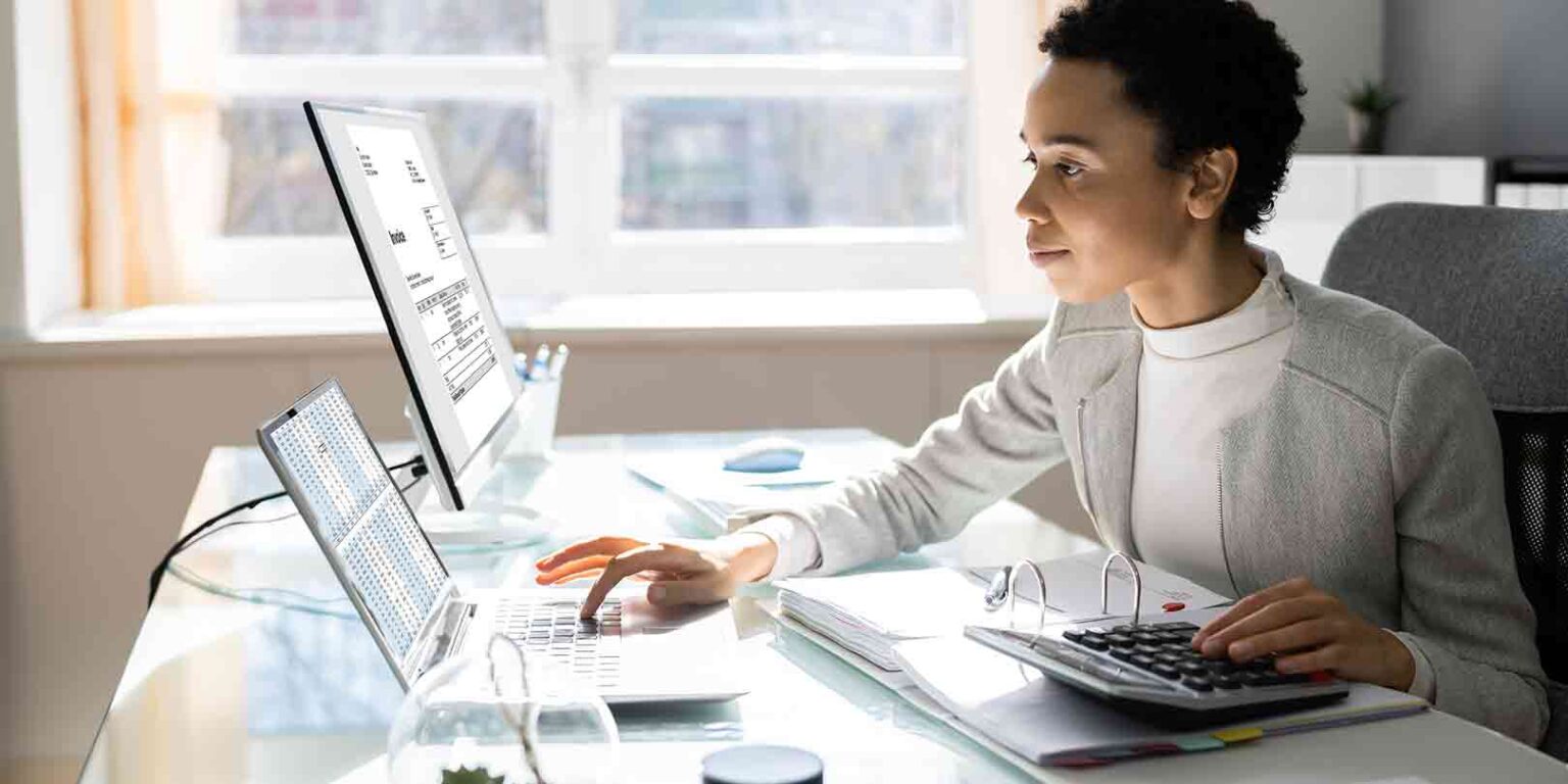 Woman in modern office using computer